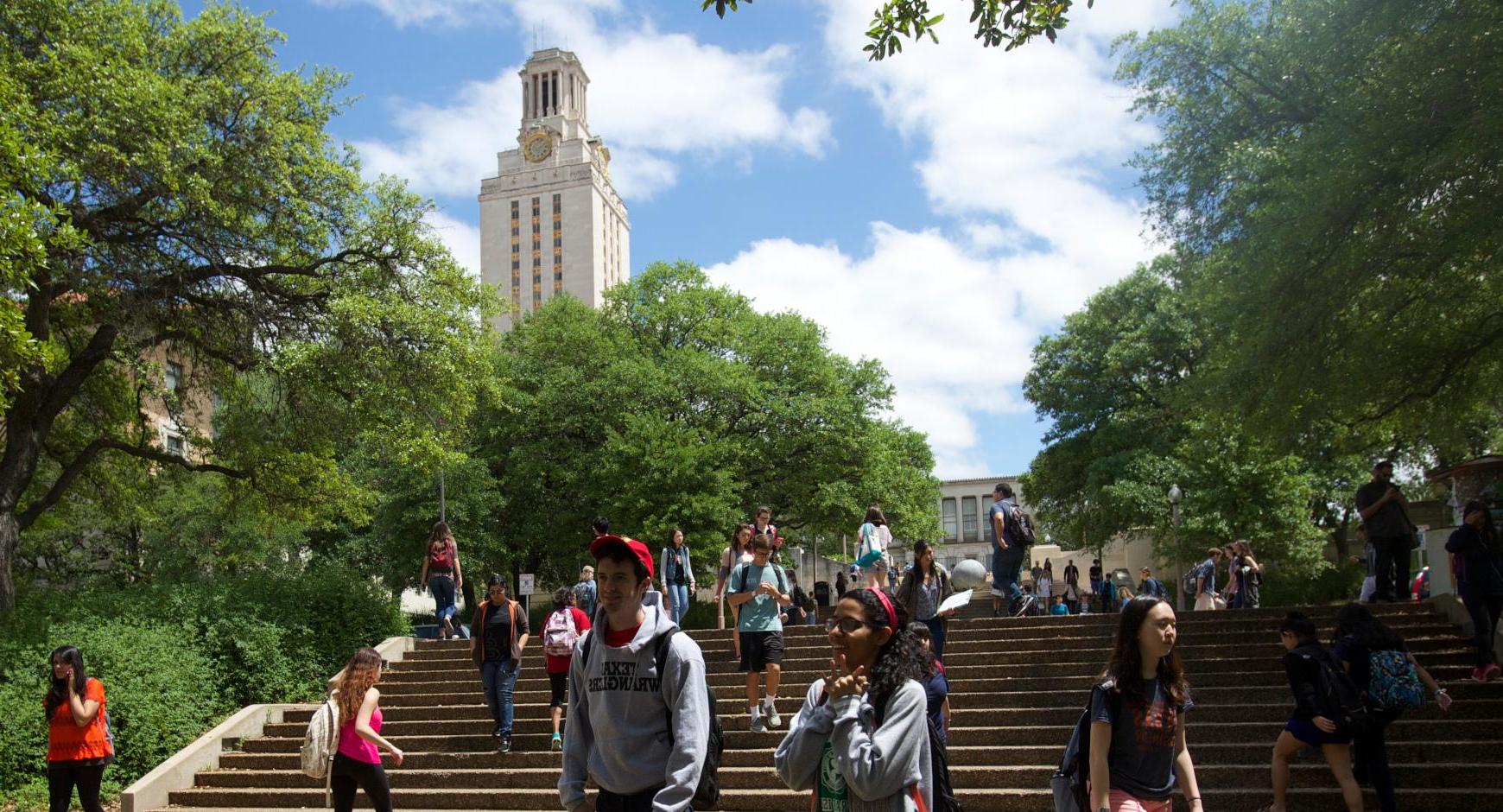 students walking in front of UT Tower