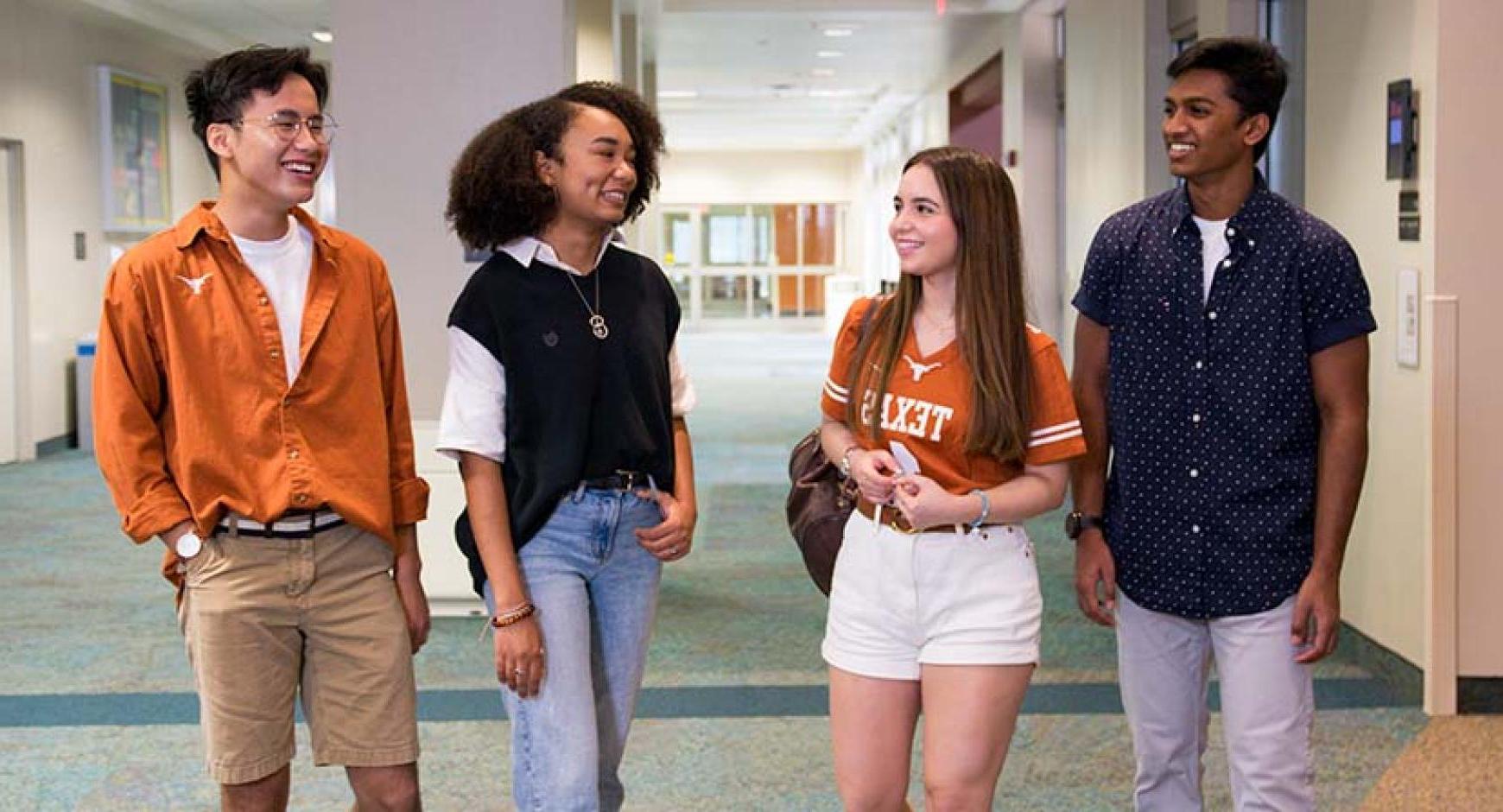 Students talking in a dorm hallway